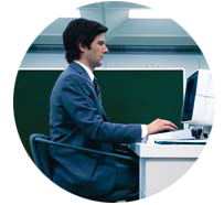 Man sitting in front of a computer, from the movie The Severance